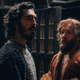 The Green Knight’s Dev Patel and Joel Edgerton gaze wistfully into the distance.